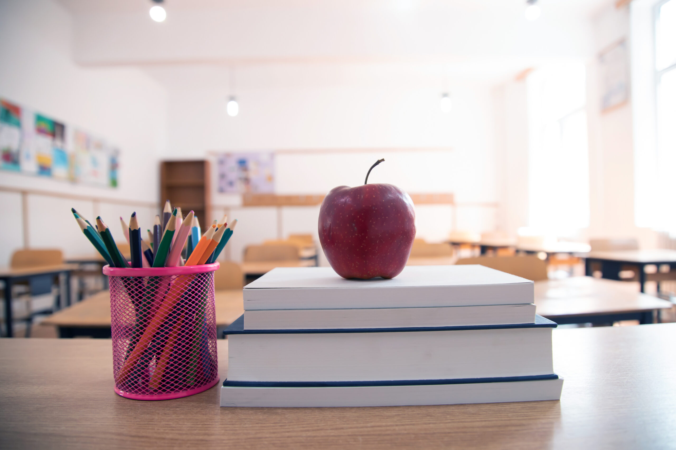 Pencils and books in the classroom. Education concept.